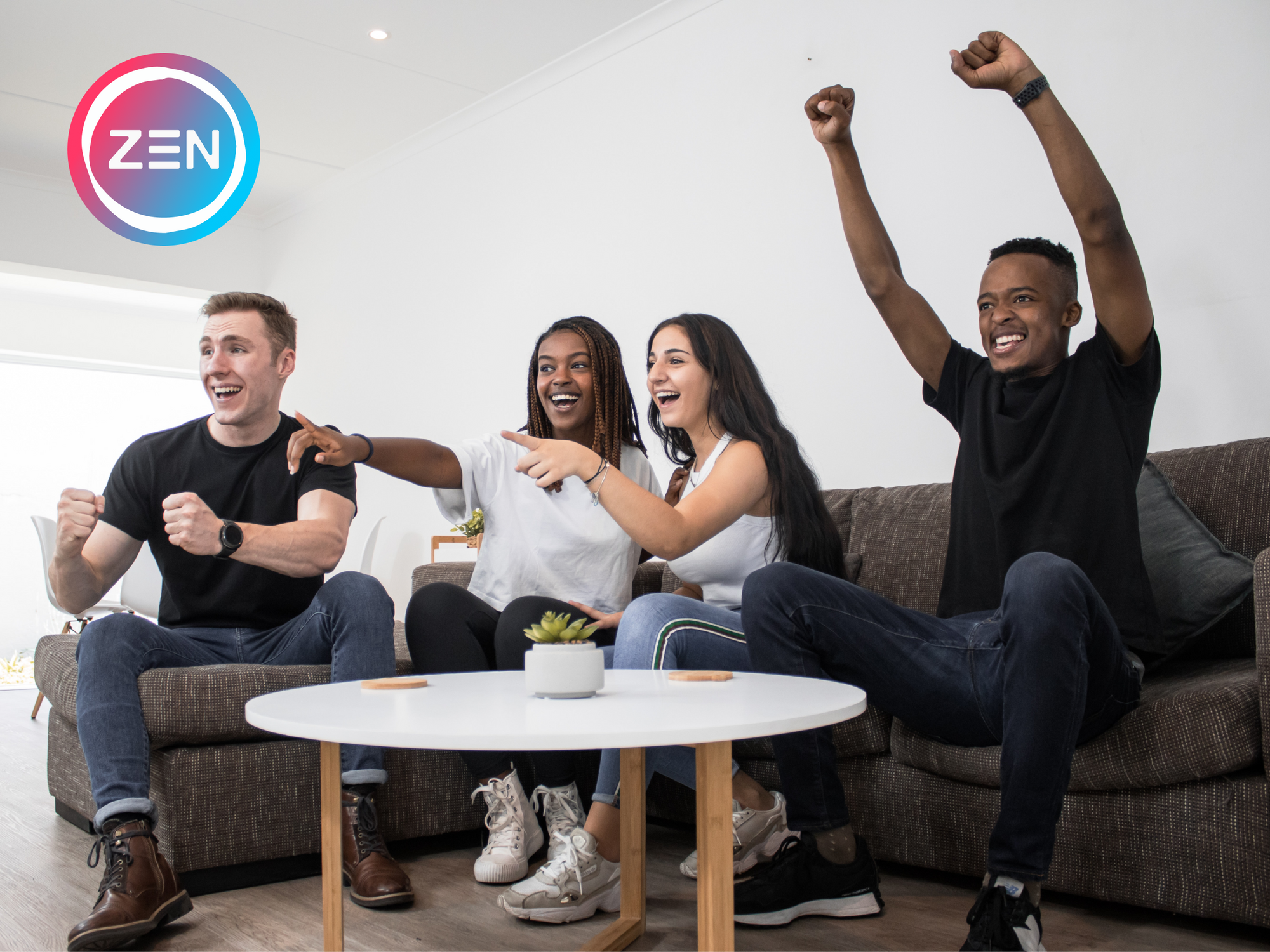 A group of friends sitting on couch pointing and cheering 
