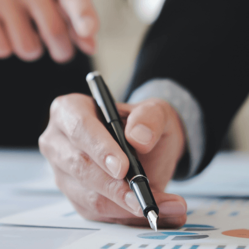 Background photo of a person signing a credit repair form