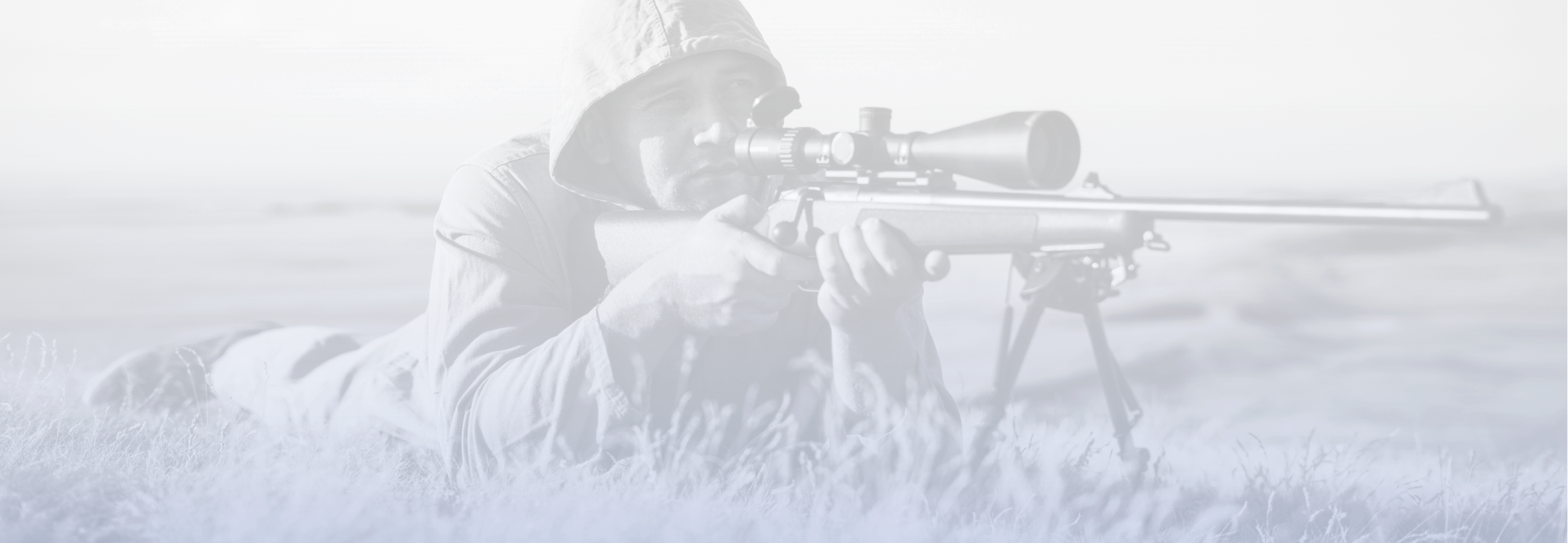 Background image of man prone in a field aiming down a rifle's sight