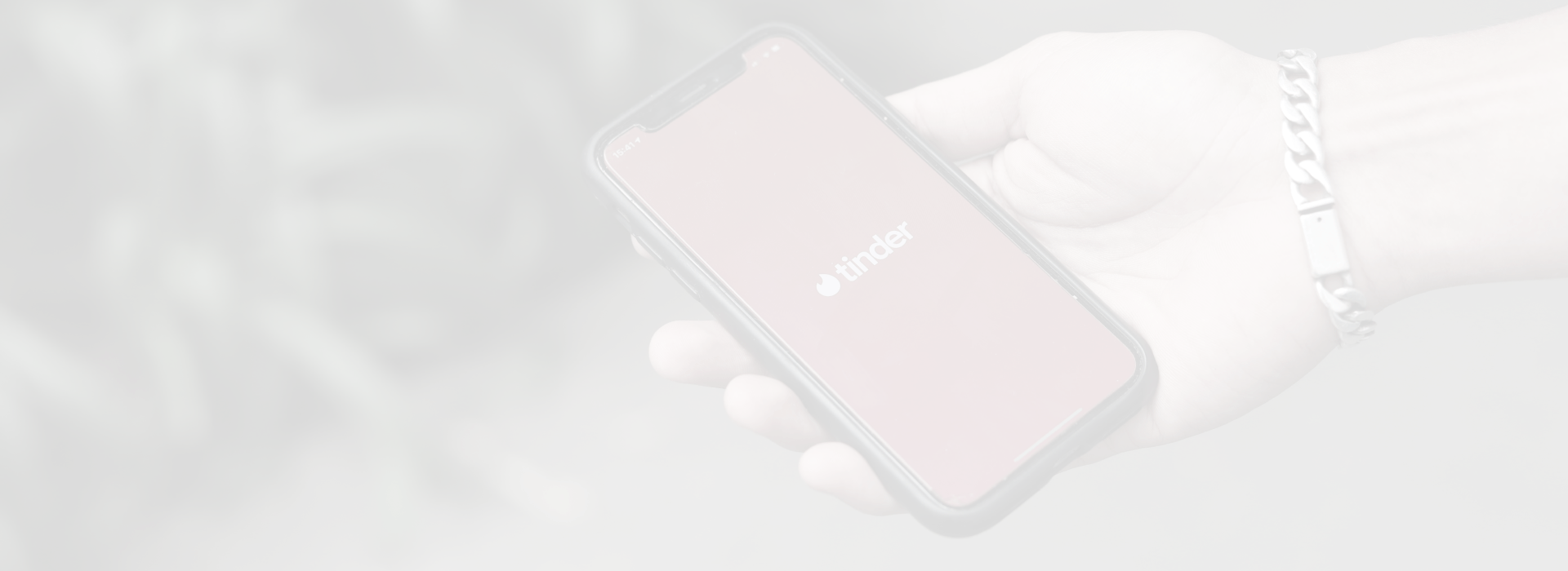 Background image of two scientists clipping a plant